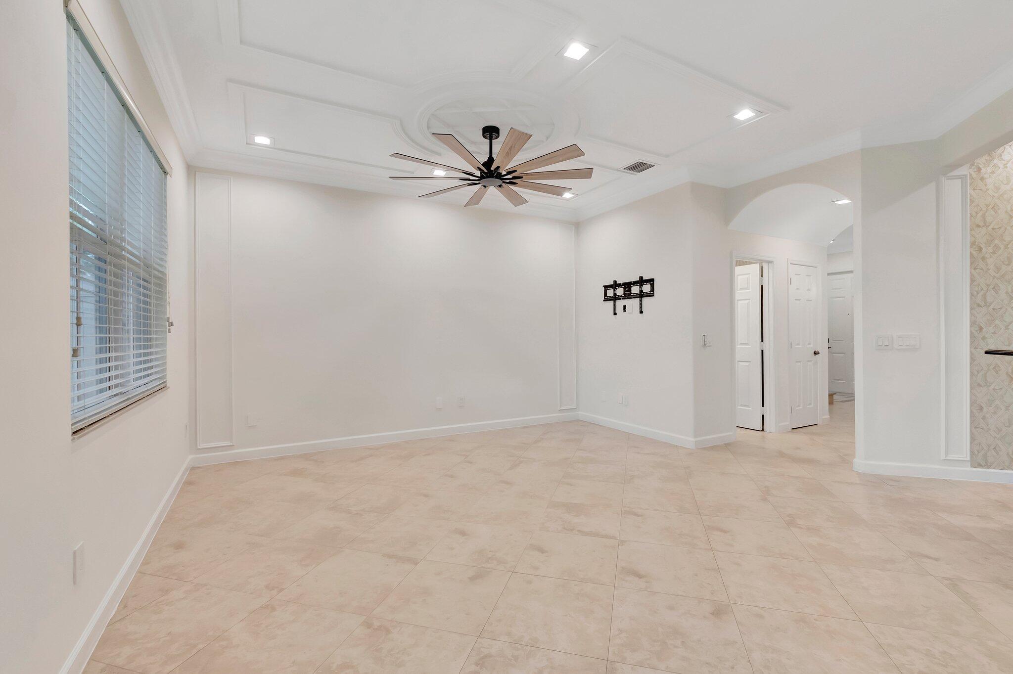 100 West Prive Circle Delray Beach, FL 33445 - Photo 12 of 43 an empty room with fan and windows