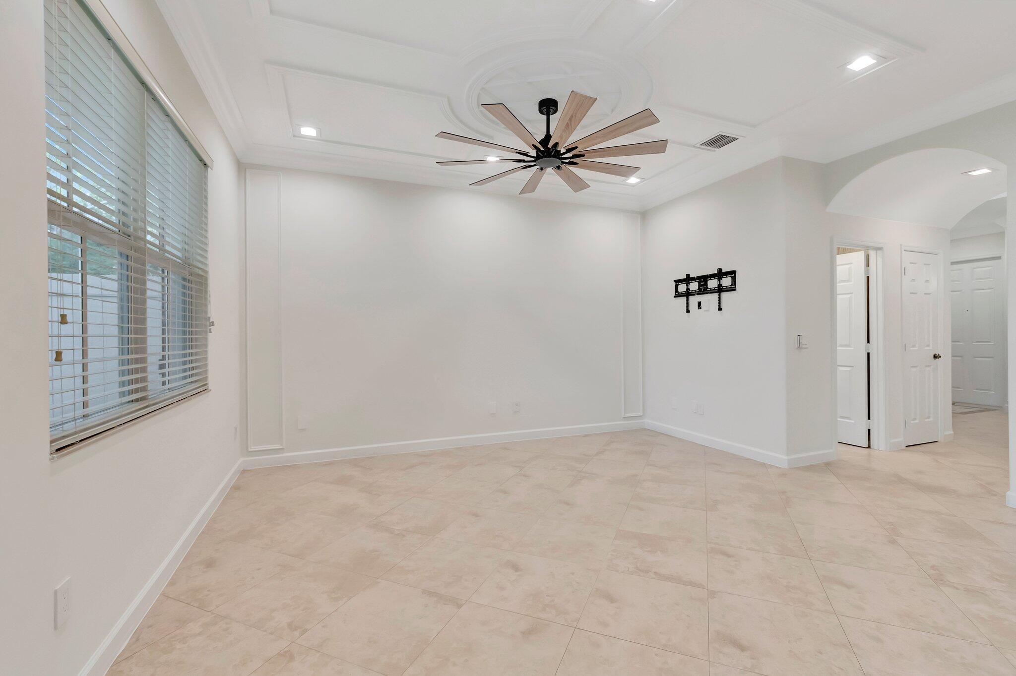 100 West Prive Circle Delray Beach, FL 33445 - Photo 13 of 43 an empty room with windows and fan