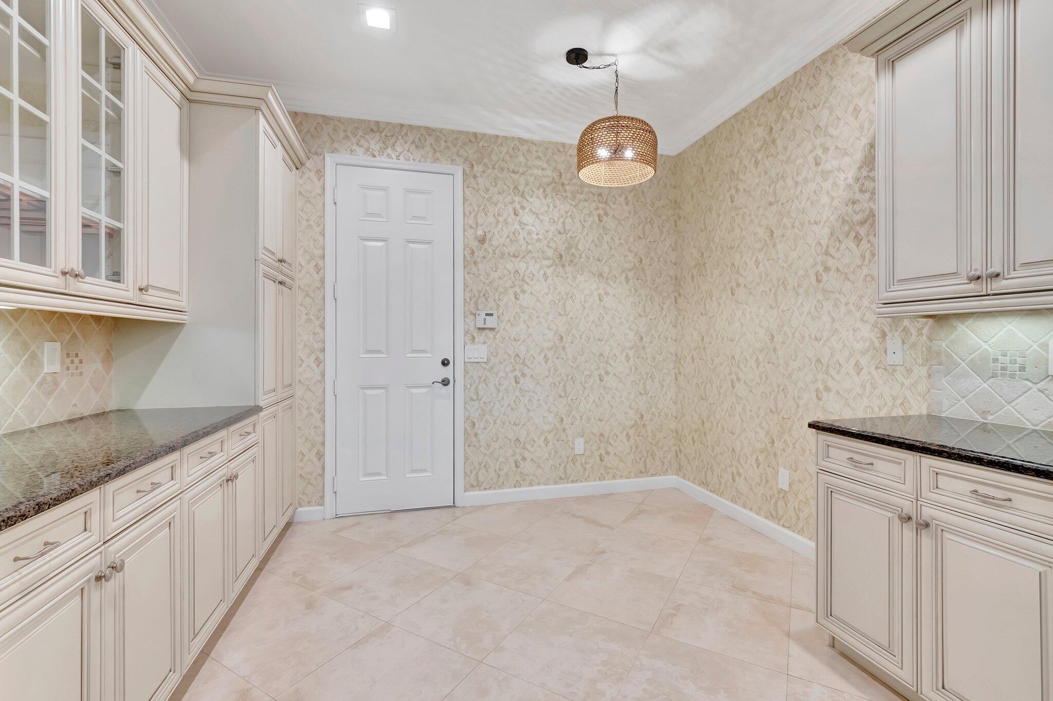 100 West Prive Circle Delray Beach, FL 33445 - Photo 20 of 43 a bathroom with a granite countertop sink and a mirror