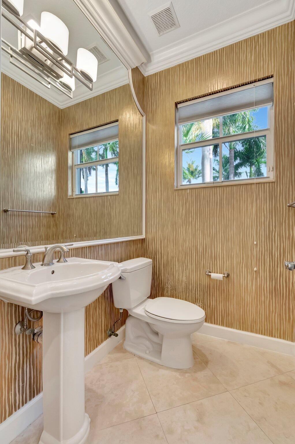 100 West Prive Circle Delray Beach, FL 33445 - Photo 22 of 43 a bathroom with a sink and mirror