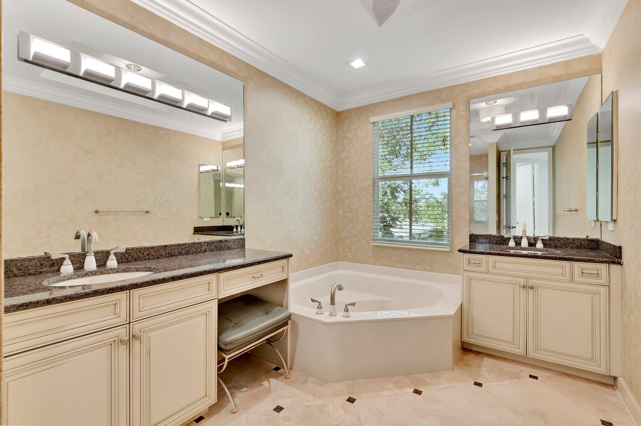 100 West Prive Circle Delray Beach, FL 33445 - Photo 27 of 43 a bathroom with a granite countertop sink mirror and bathtub