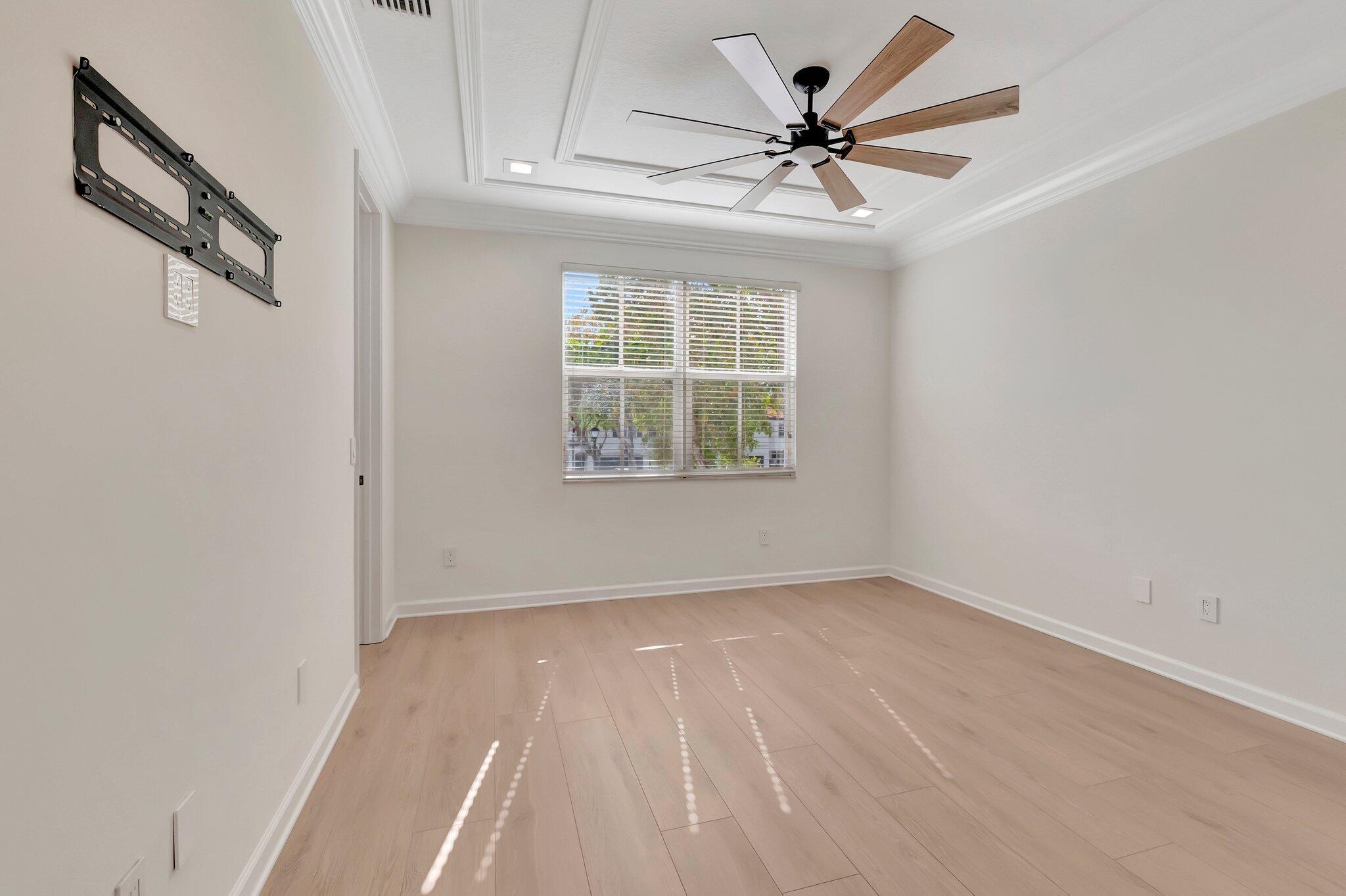 100 West Prive Circle Delray Beach, FL 33445 - Photo 31 of 43 an empty room with windows and fan