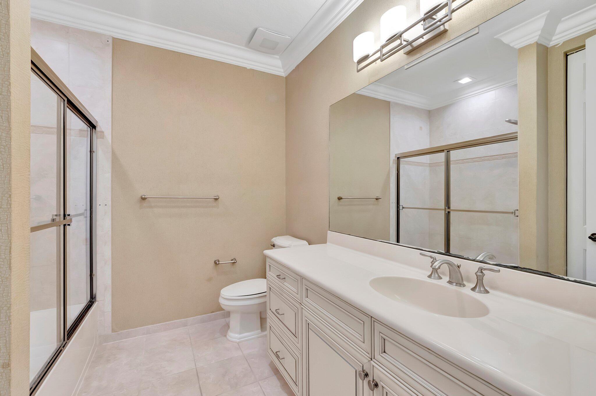 100 West Prive Circle Delray Beach, FL 33445 - Photo 33 of 43 a bathroom with a sink a toilet and shower