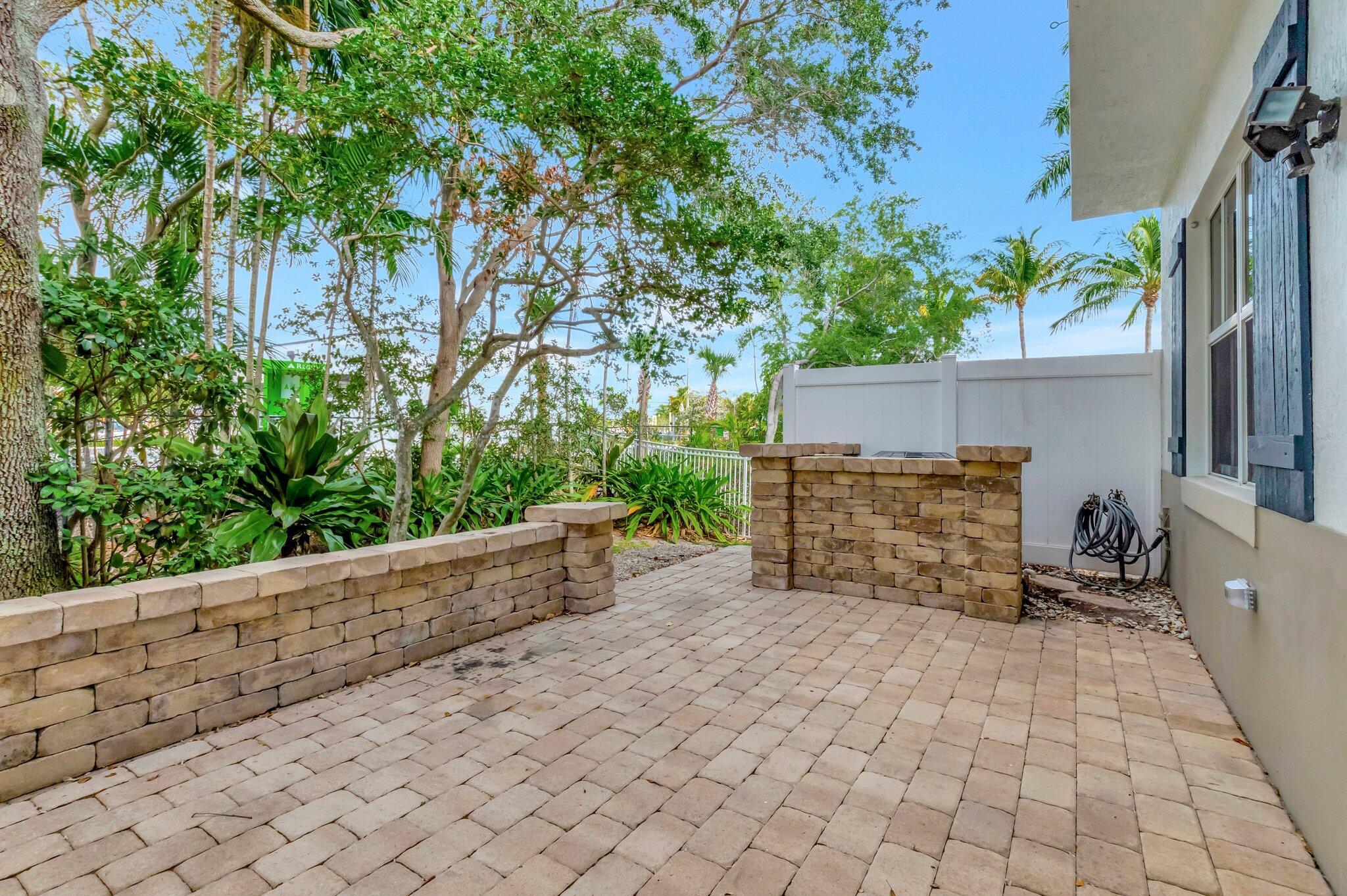 100 West Prive Circle Delray Beach, FL 33445 - Photo 36 of 43 a view of a backyard with pathway