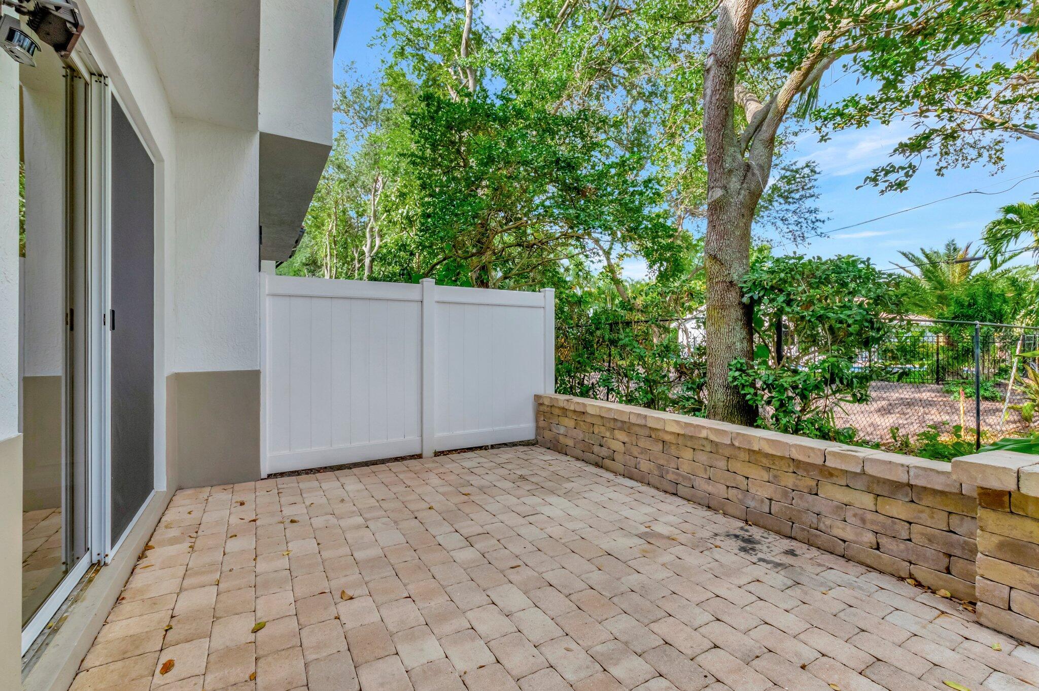100 West Prive Circle Delray Beach, FL 33445 - Photo 37 of 43 a view of a backyard of the house