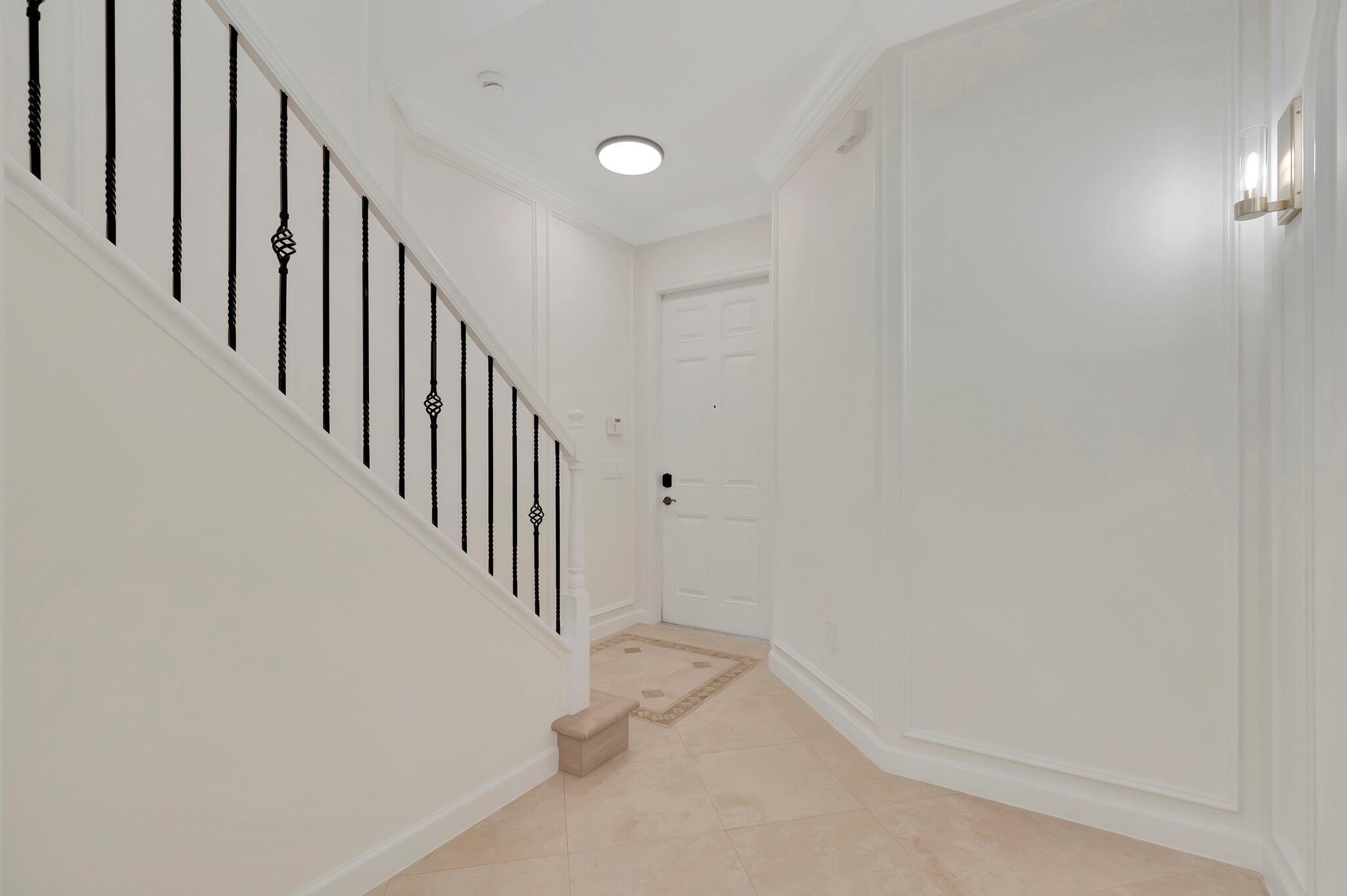 100 West Prive Circle Delray Beach, FL 33445 - Photo 7 of 43 a view of a hallway with staircase