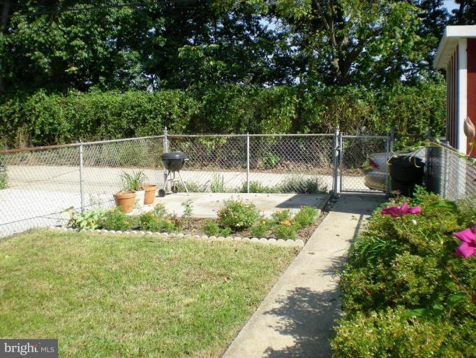 1058 Elm Road Arbutus, MD 21227 - Photo 6 of 17 Patio area in rear of fenced yard w/view of trees
