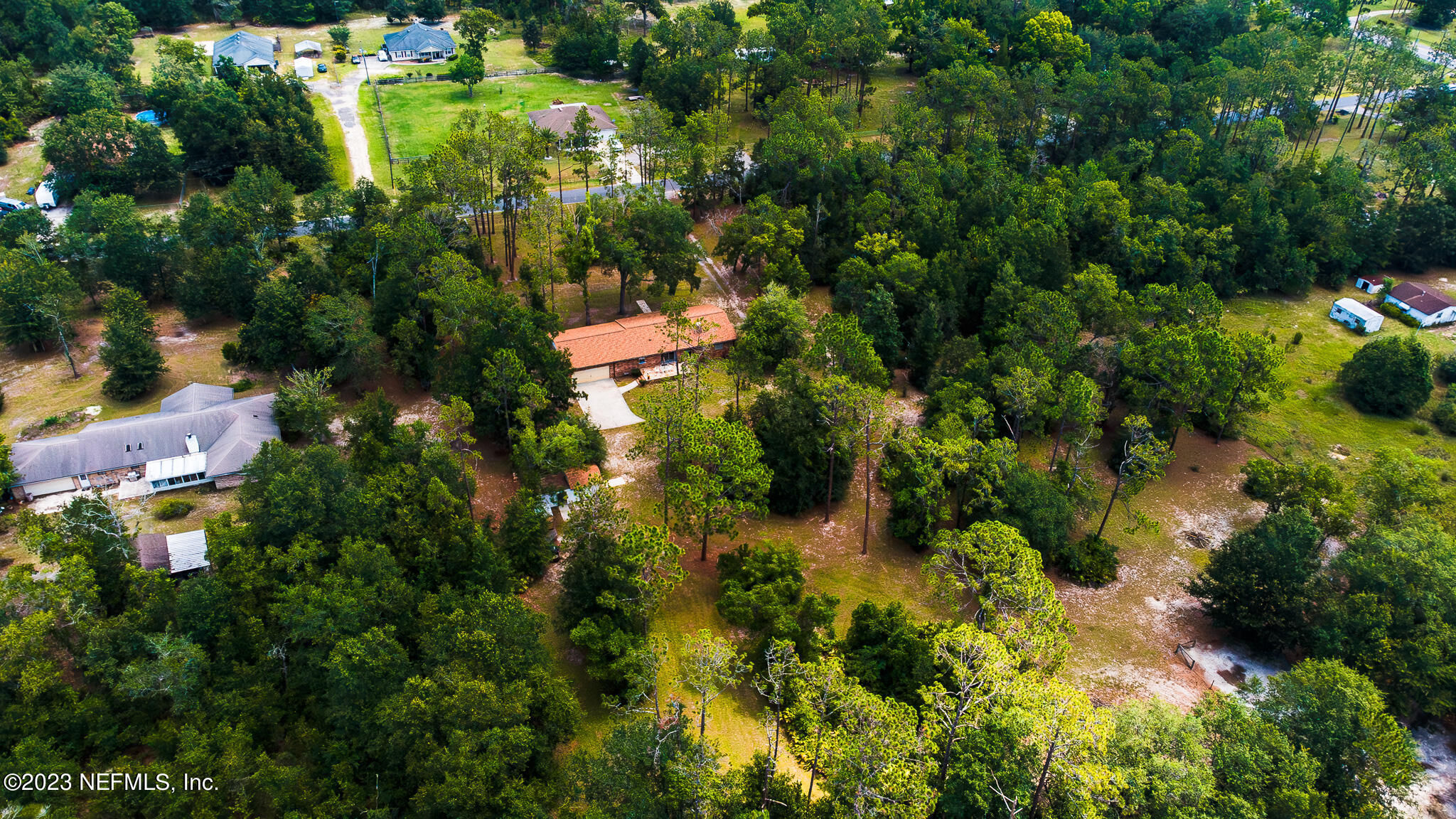3991 Bronco Road Middleburg, FL 32068 - Photo 1 of 41 an aerial view of residential house with outdoor space and trees all around