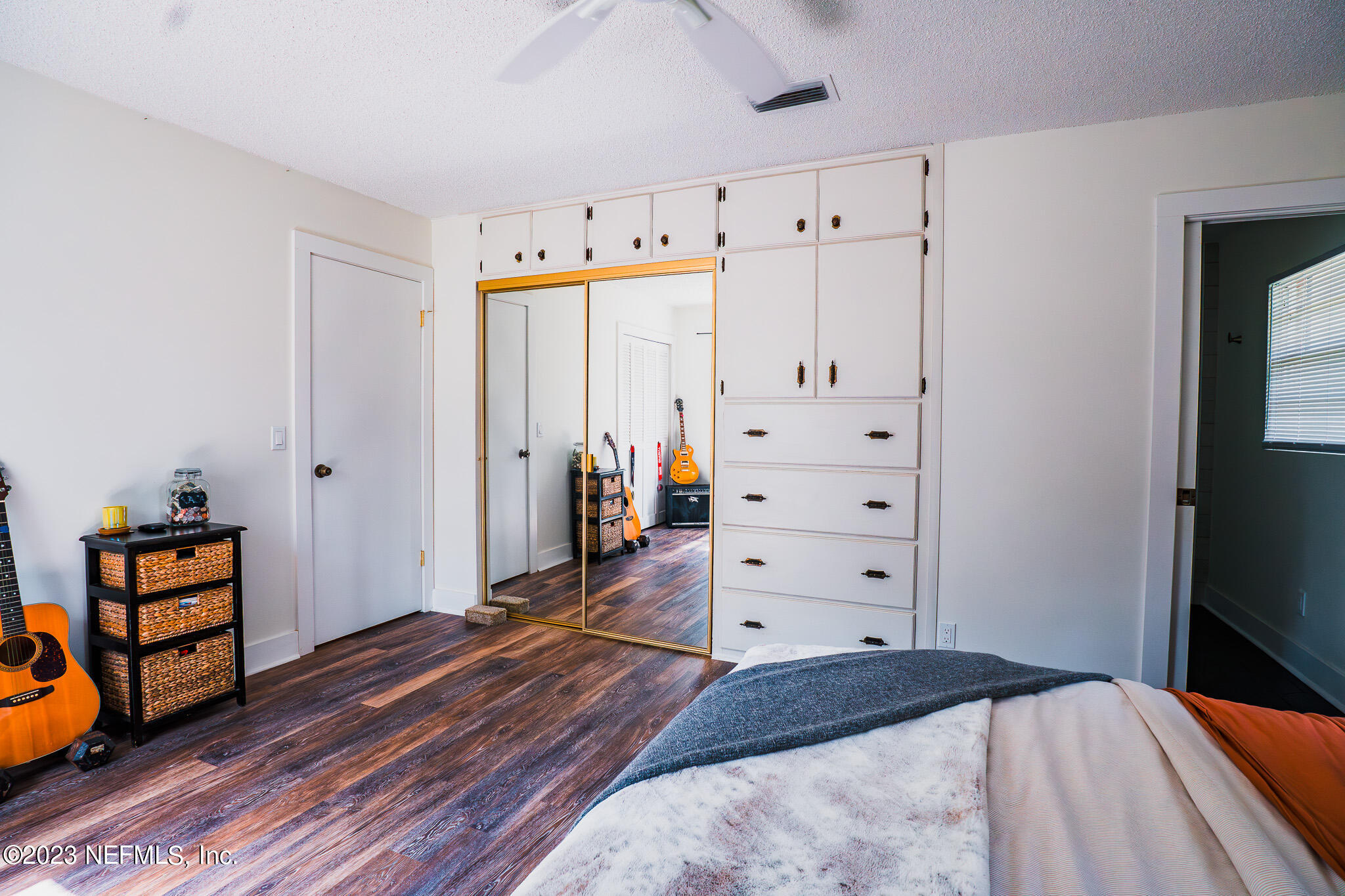 3991 Bronco Road Middleburg, FL 32068 - Photo 23 of 41 a bedroom with a bed and wooden floor