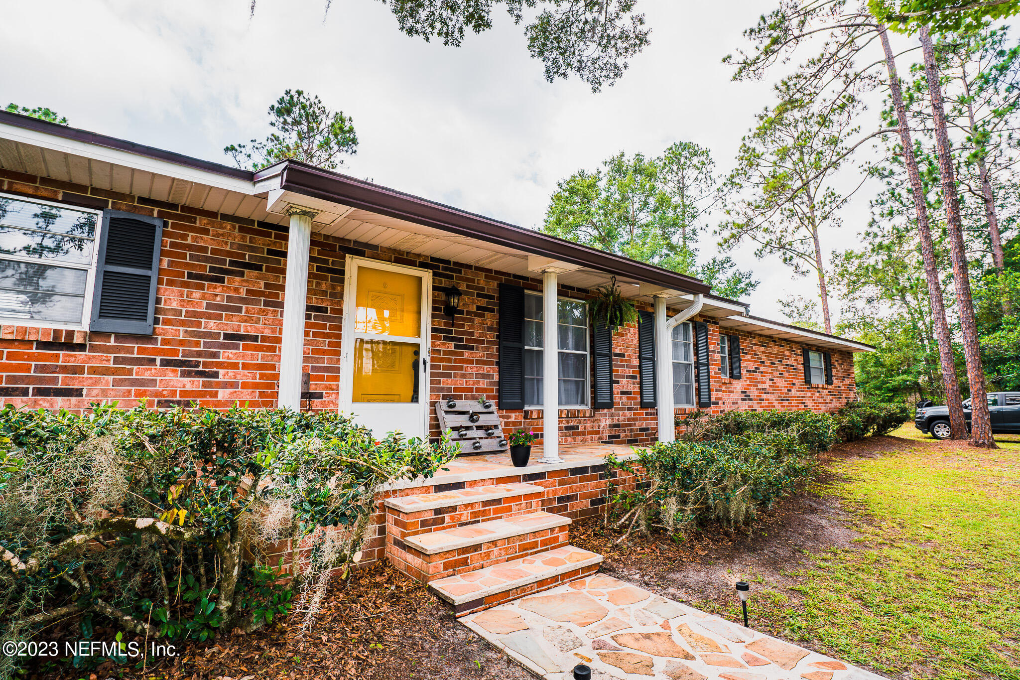 3991 Bronco Road Middleburg, FL 32068 - Photo 3 of 41 a front view of a house with garden