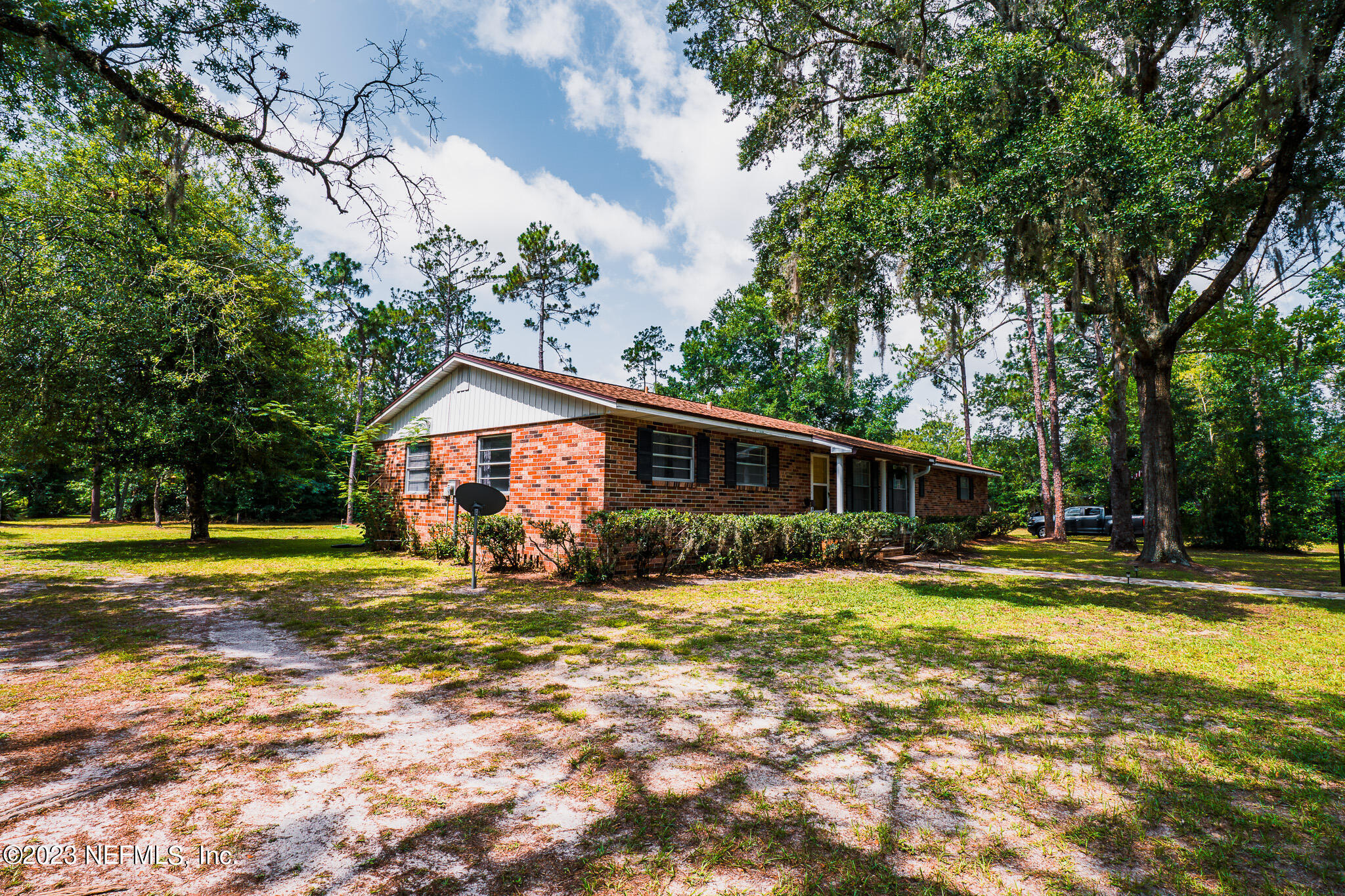 3991 Bronco Road Middleburg, FL 32068 - Photo 34 of 41 a view of a house with a yard