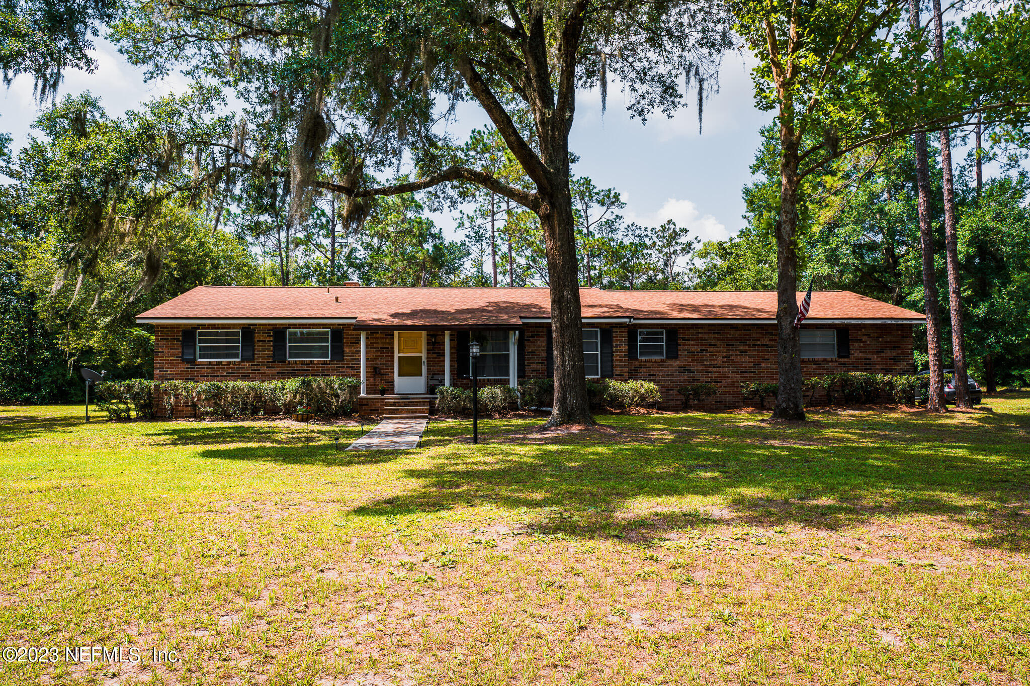 3991 Bronco Road Middleburg, FL 32068 - Photo 36 of 41 a front view of a house with swimming pool having outdoor seating