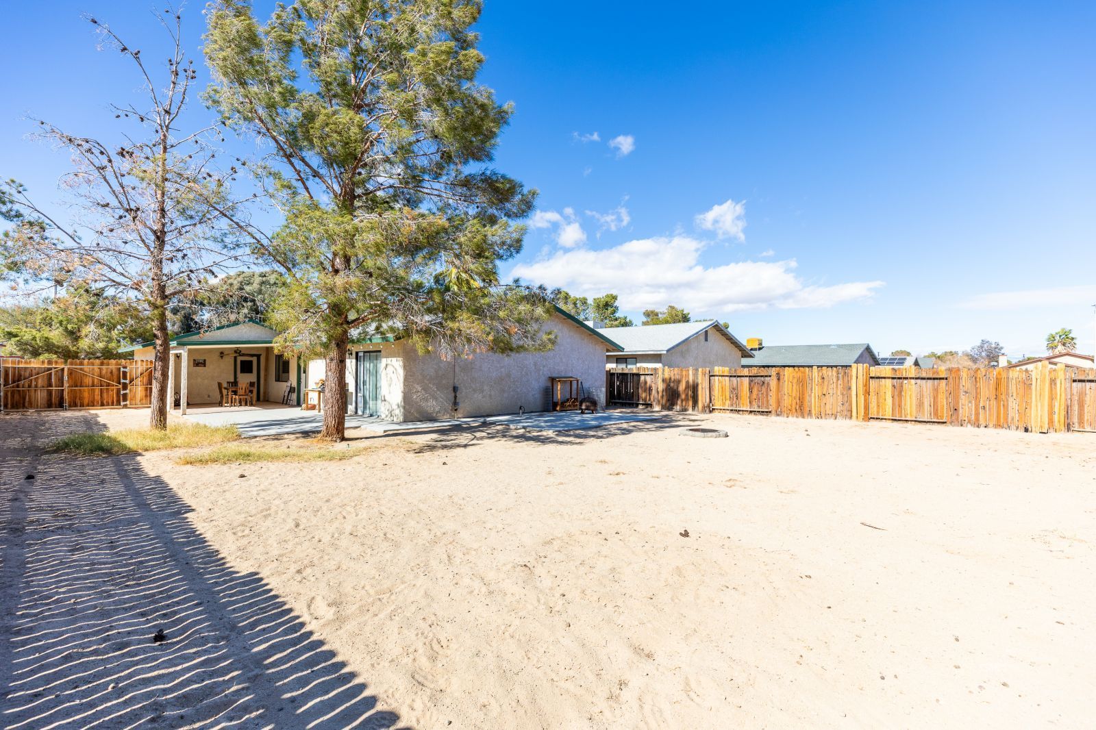 332 Sims Street Ridgecrest, CA 93555 - Photo 28 of 29 a street view with large trees