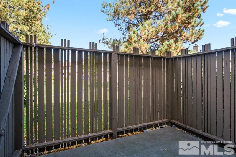 4853 Reggie Road Reno, NV 89502 - Photo 12 of 27 a view of a backyard with wooden fence