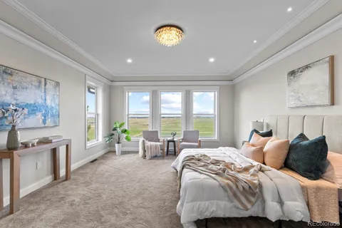 a spacious bedroom with a bed and a couch