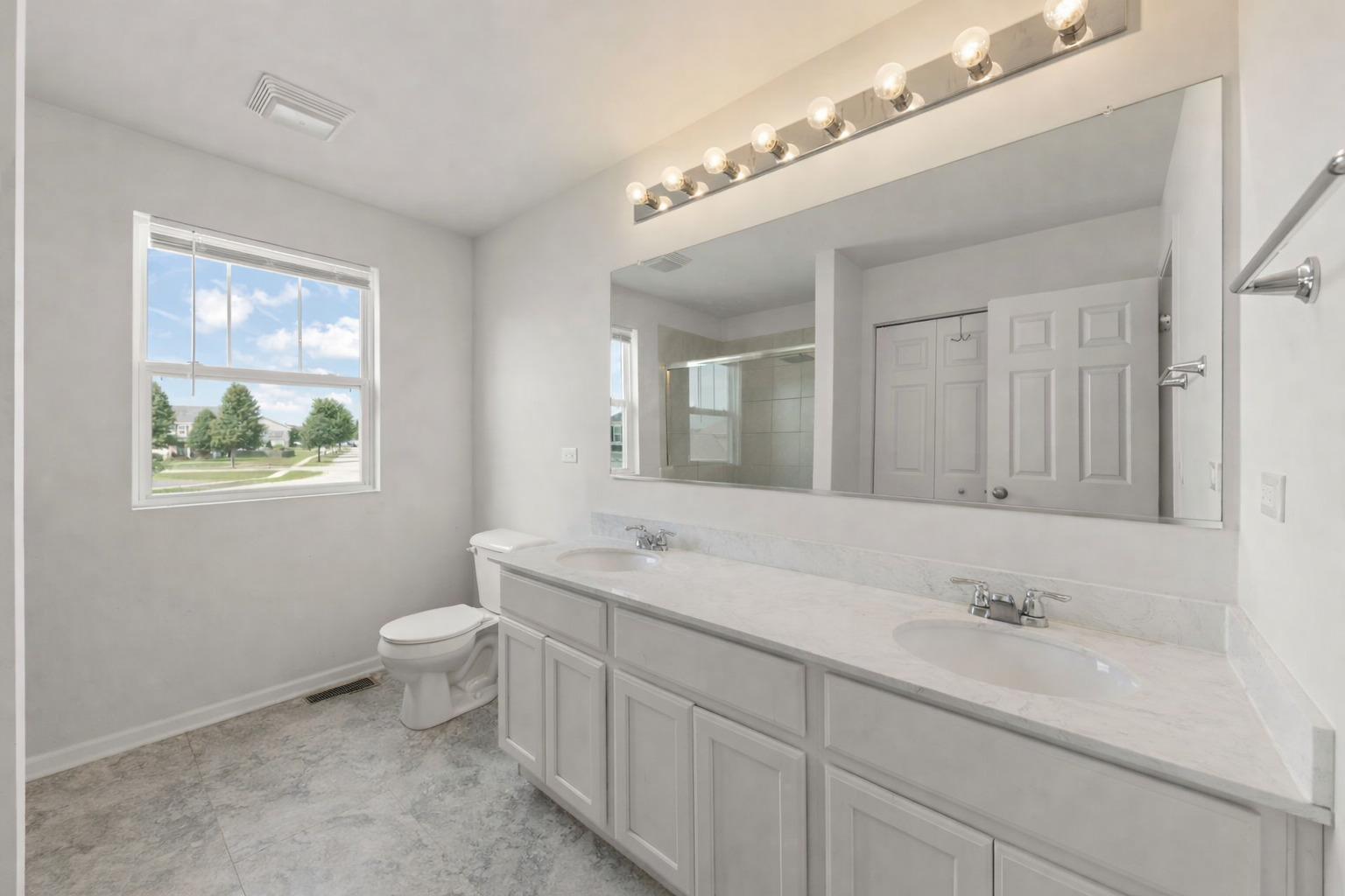 114 Schmidt Court Plano, IL 60545 - Photo 11 of 18 a bathroom with a sink and a mirror