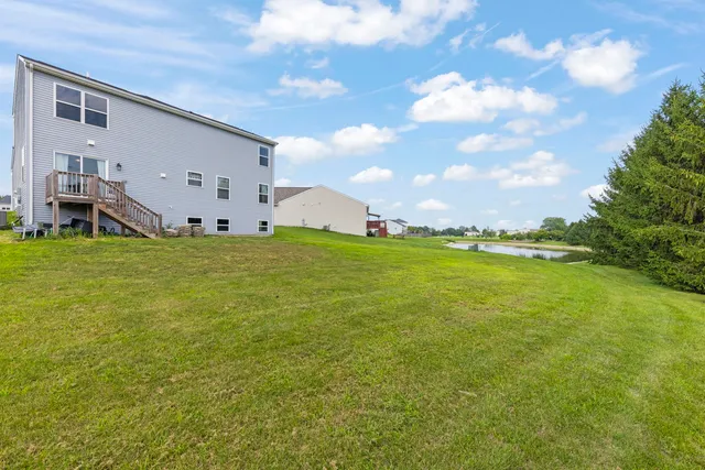 a view of a large pool with an outdoor space