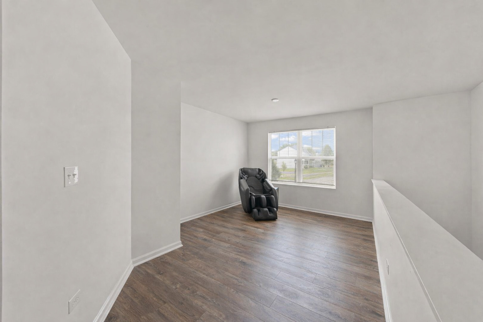 114 Schmidt Court Plano, IL 60545 - Photo 9 of 18 a view of an empty room with wooden floor and a window