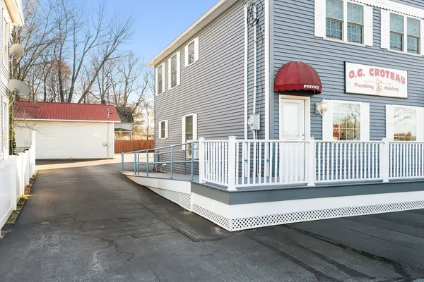 a view of a house with a bench