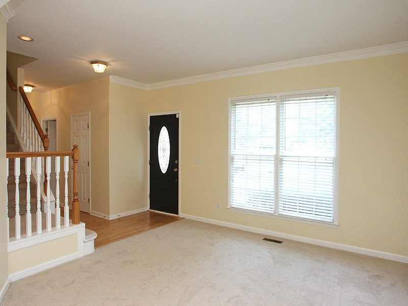 2305 Kendricks Court Raleigh, NC 27613 - Photo 2 of 23 Light and airy living room with crown molding, new carpet. Living Room