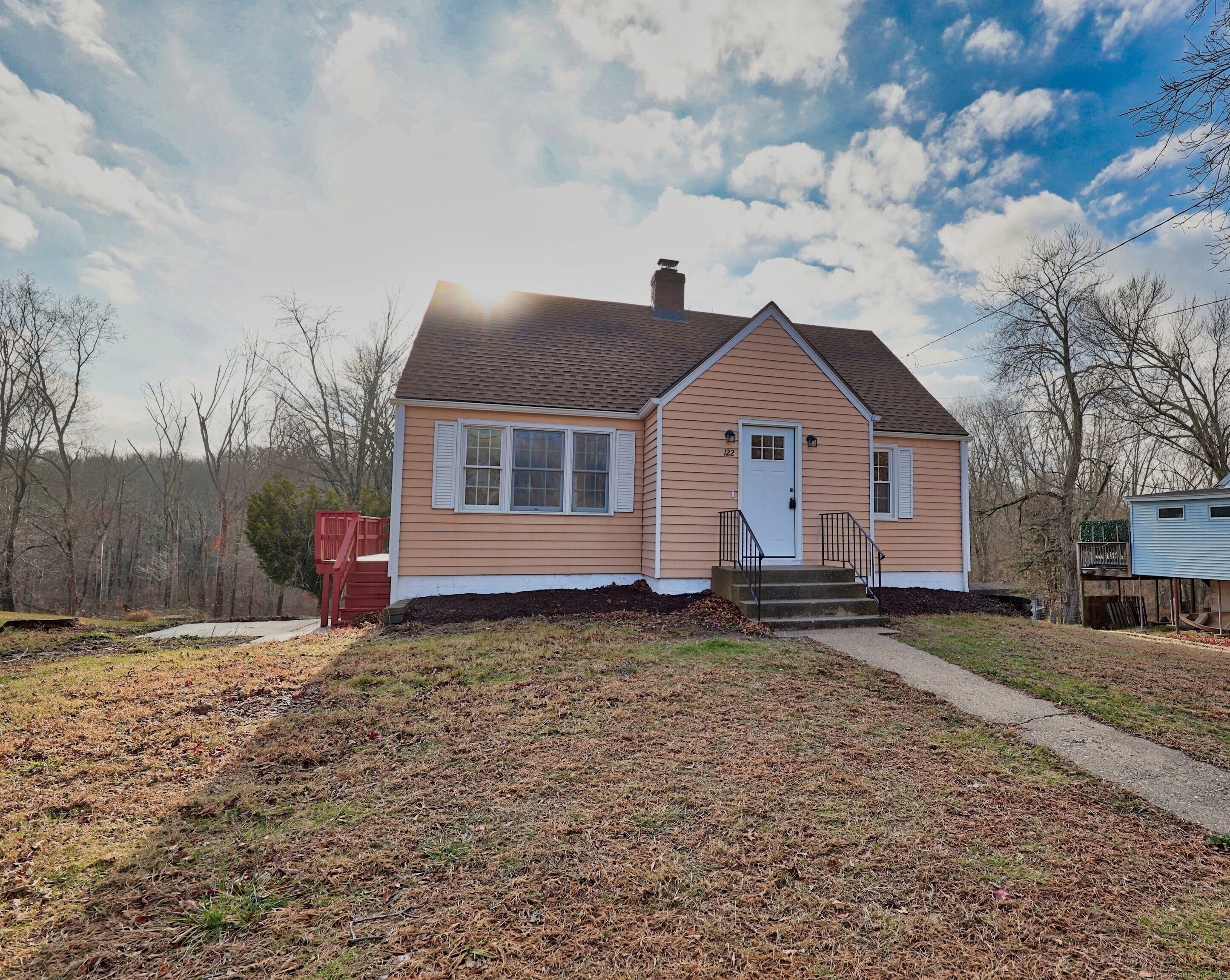 a front view of a house with a yard