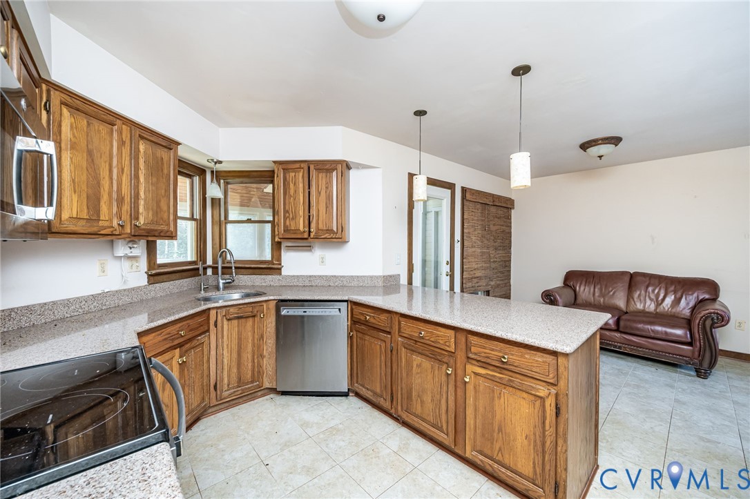 8902 Duchess Way Chesterfield, VA 23832 - Photo 12 of 34 a kitchen with stainless steel appliances granite countertop a sink a stove and a wooden floors