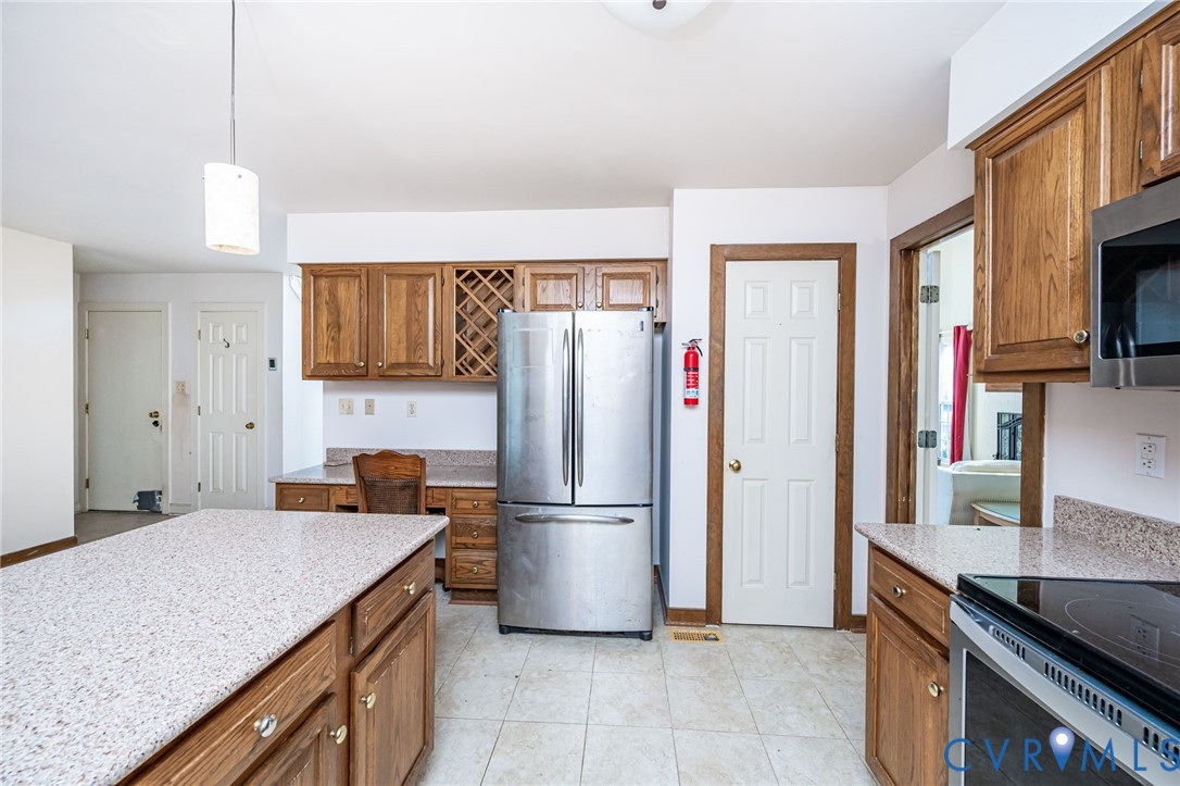 8902 Duchess Way Chesterfield, VA 23832 - Photo 13 of 34 a kitchen with stainless steel appliances granite countertop a refrigerator a sink and a stove