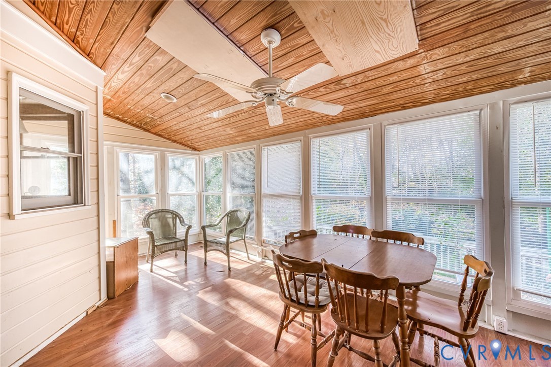 8902 Duchess Way Chesterfield, VA 23832 - Photo 15 of 34 a dining room with furniture a chandelier and wooden floor