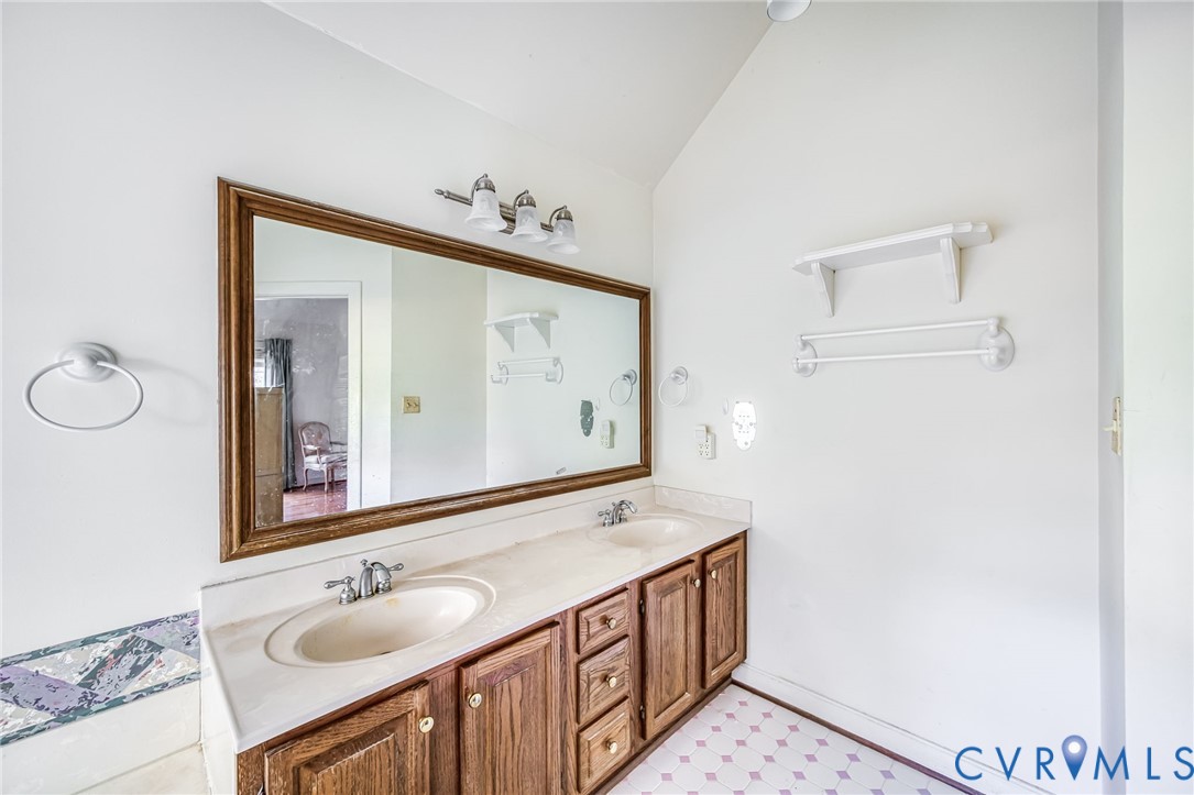 8902 Duchess Way Chesterfield, VA 23832 - Photo 17 of 34 a bathroom with a sink vanity and mirror