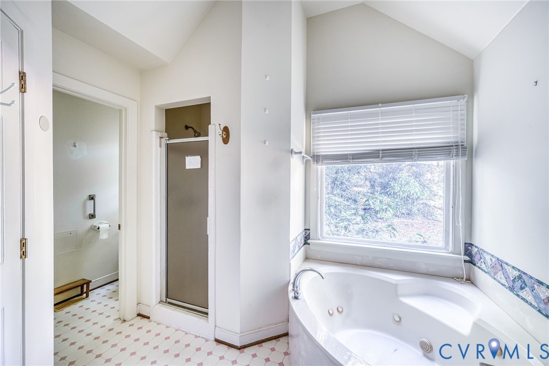 8902 Duchess Way Chesterfield, VA 23832 - Photo 18 of 34 a bathroom with a tub and a shower