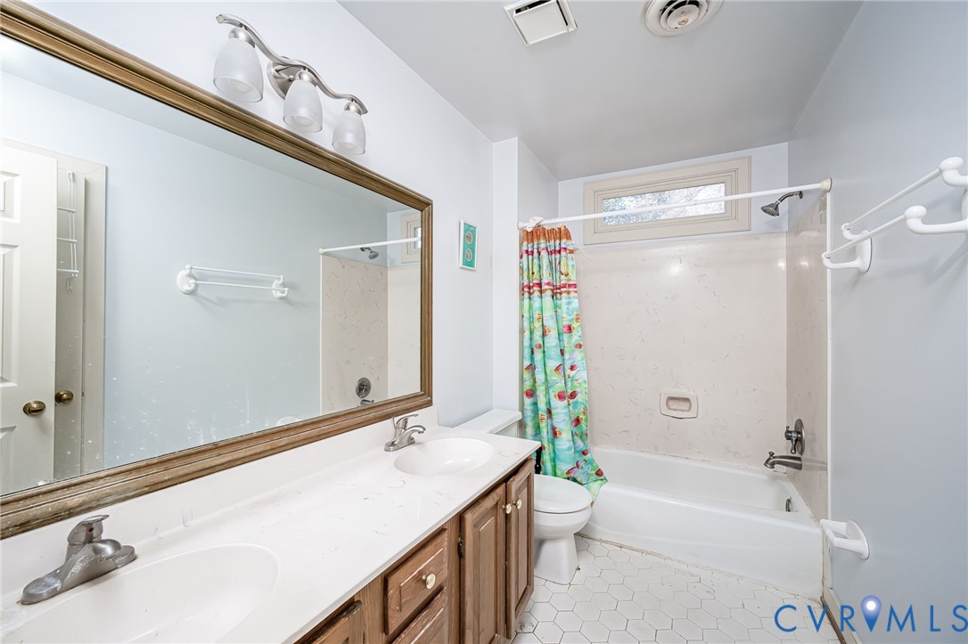 8902 Duchess Way Chesterfield, VA 23832 - Photo 28 of 34 a bathroom with a tub sink and mirror