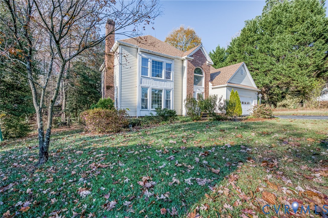 8902 Duchess Way Chesterfield, VA 23832 - Photo 3 of 34 a front view of house with yard and trees around