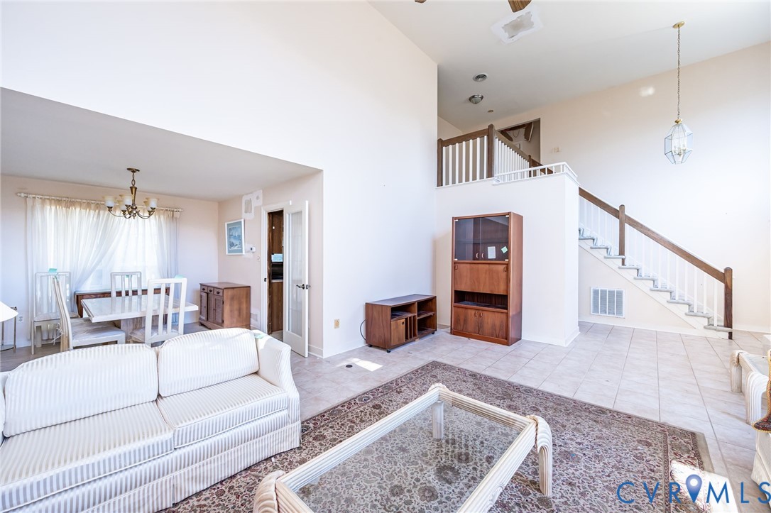8902 Duchess Way Chesterfield, VA 23832 - Photo 8 of 34 a living room with furniture and a wooden floor