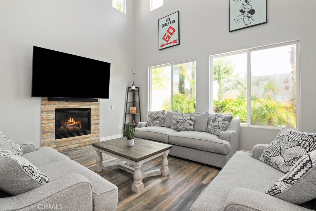 31319 Locust Court Temecula, CA 92592 - Photo 13 of 75 a living room with furniture a flat screen tv and a fireplace