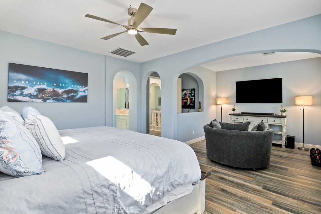 31319 Locust Court Temecula, CA 92592 - Photo 31 of 75 a bedroom with a bed and a flat screen tv