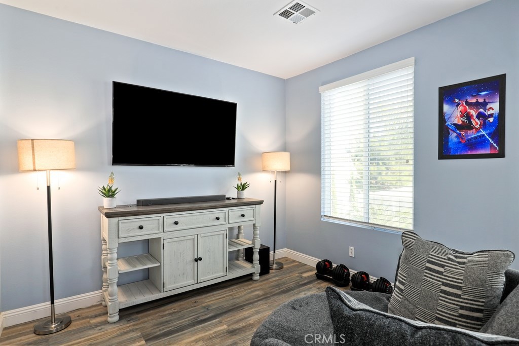 31319 Locust Court Temecula, CA 92592 - Photo 33 of 75 a living room with furniture and a flat screen tv