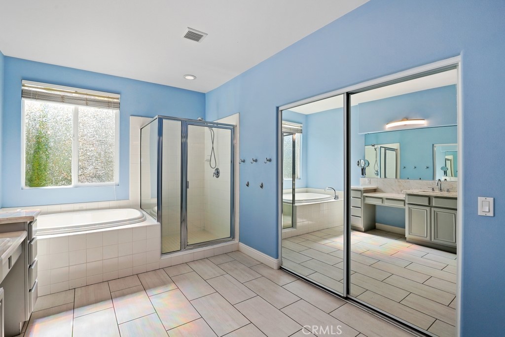 31319 Locust Court Temecula, CA 92592 - Photo 36 of 75 a bathroom with a tub shower vanity and sink