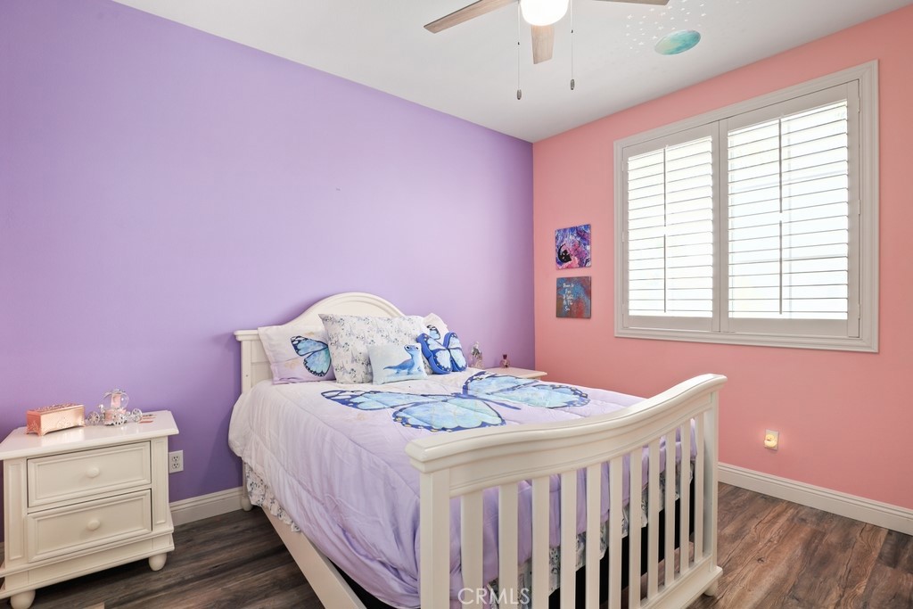 31319 Locust Court Temecula, CA 92592 - Photo 40 of 75 a bedroom with a bed and a chandelier