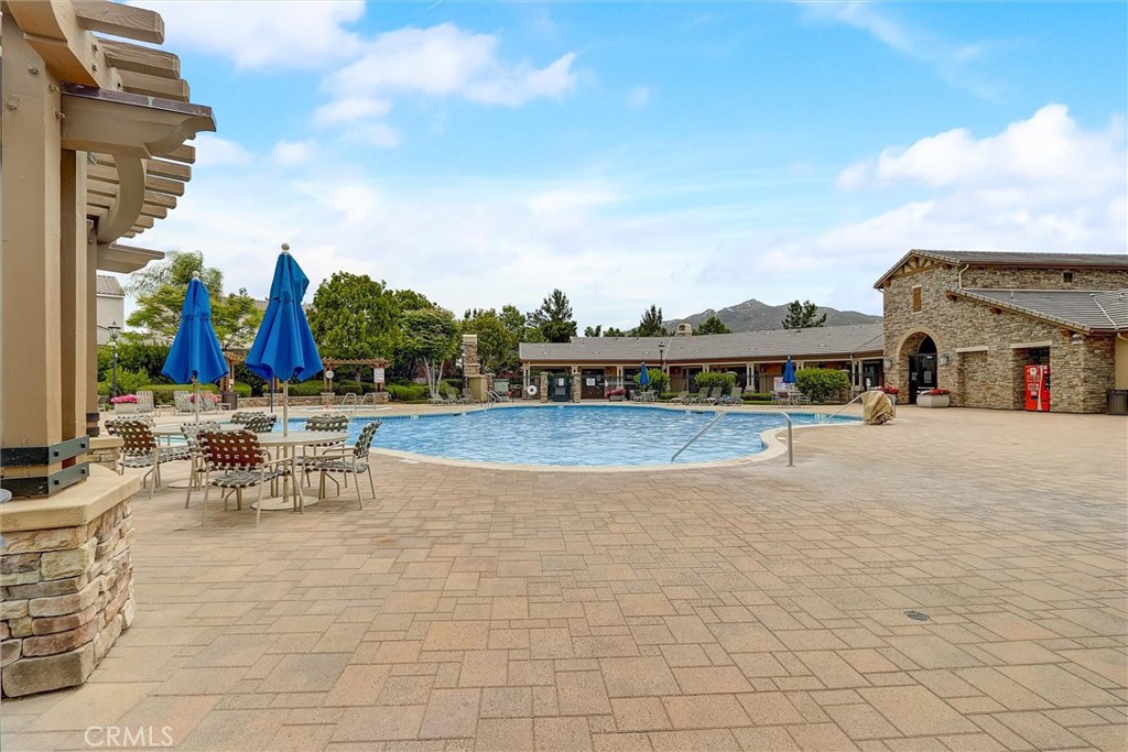 31319 Locust Court Temecula, CA 92592 - Photo 66 of 75 a view of swimming pool with outdoor seating and plants