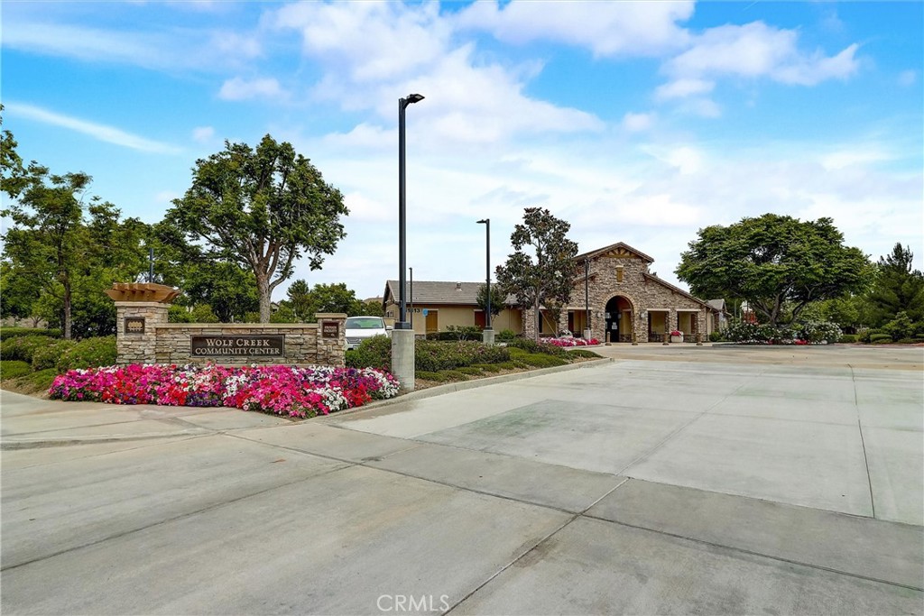 31319 Locust Court Temecula, CA 92592 - Photo 71 of 75 a front view of a multi story residential apartment building with yard