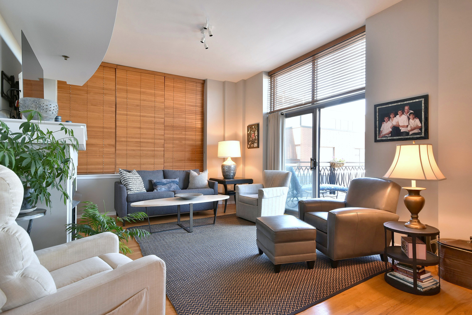 1201 West Adams Street, Unit 411 Chicago, IL 60607 - Photo 16 of 40 a living room with furniture and a flat screen tv