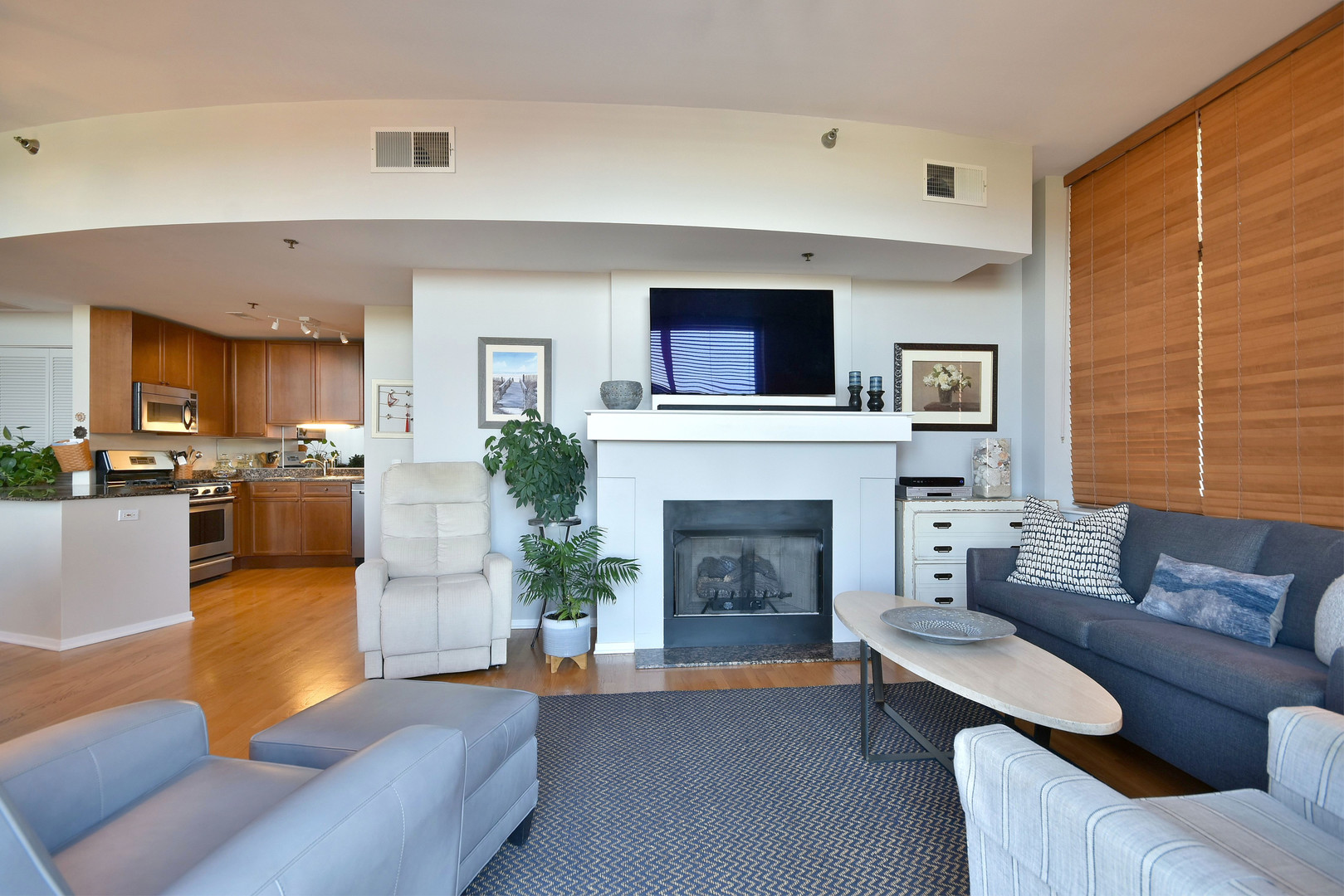 1201 West Adams Street, Unit 411 Chicago, IL 60607 - Photo 18 of 40 a living room with furniture and a fireplace