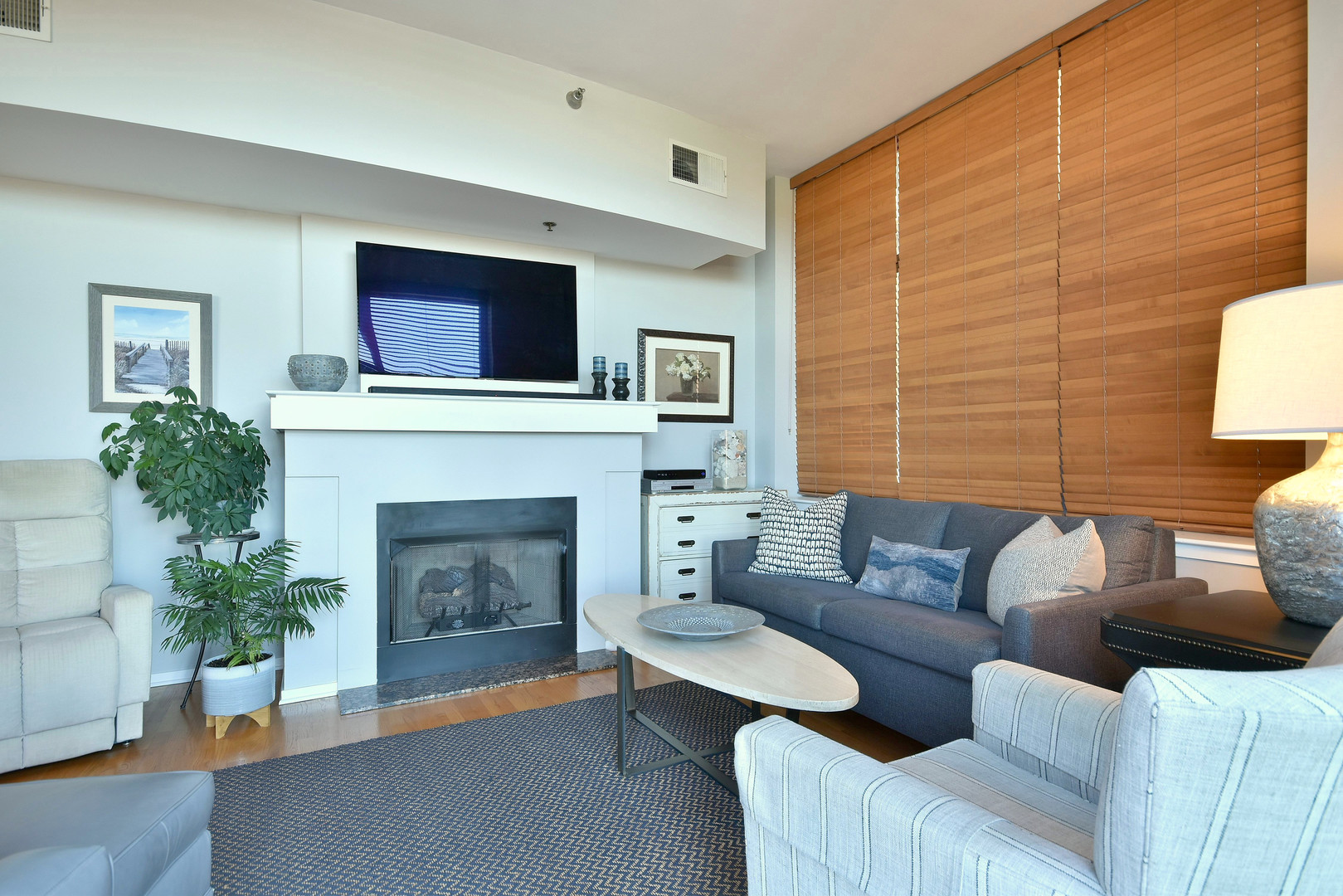 1201 West Adams Street, Unit 411 Chicago, IL 60607 - Photo 19 of 40 a living room with furniture and a fireplace