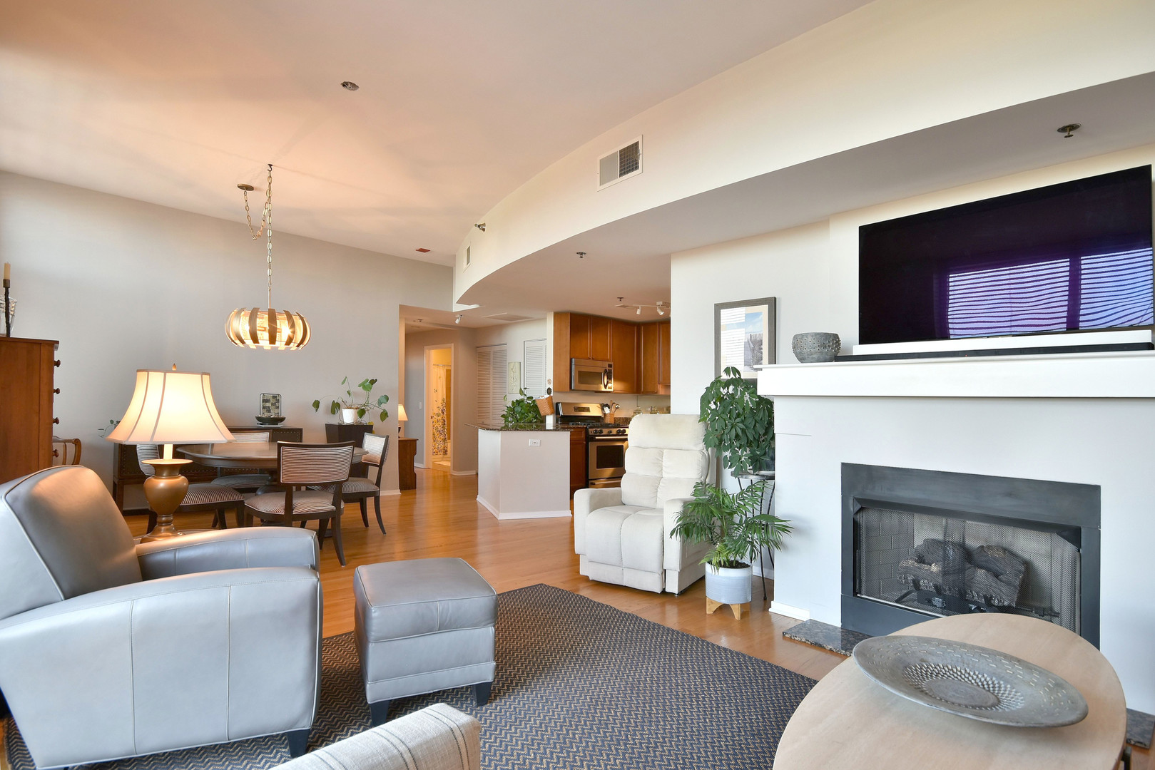 1201 West Adams Street, Unit 411 Chicago, IL 60607 - Photo 20 of 40 a living room with furniture and a fireplace