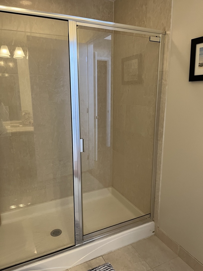 1201 West Adams Street, Unit 411 Chicago, IL 60607 - Photo 26 of 40 a bathroom with a glass shower door
