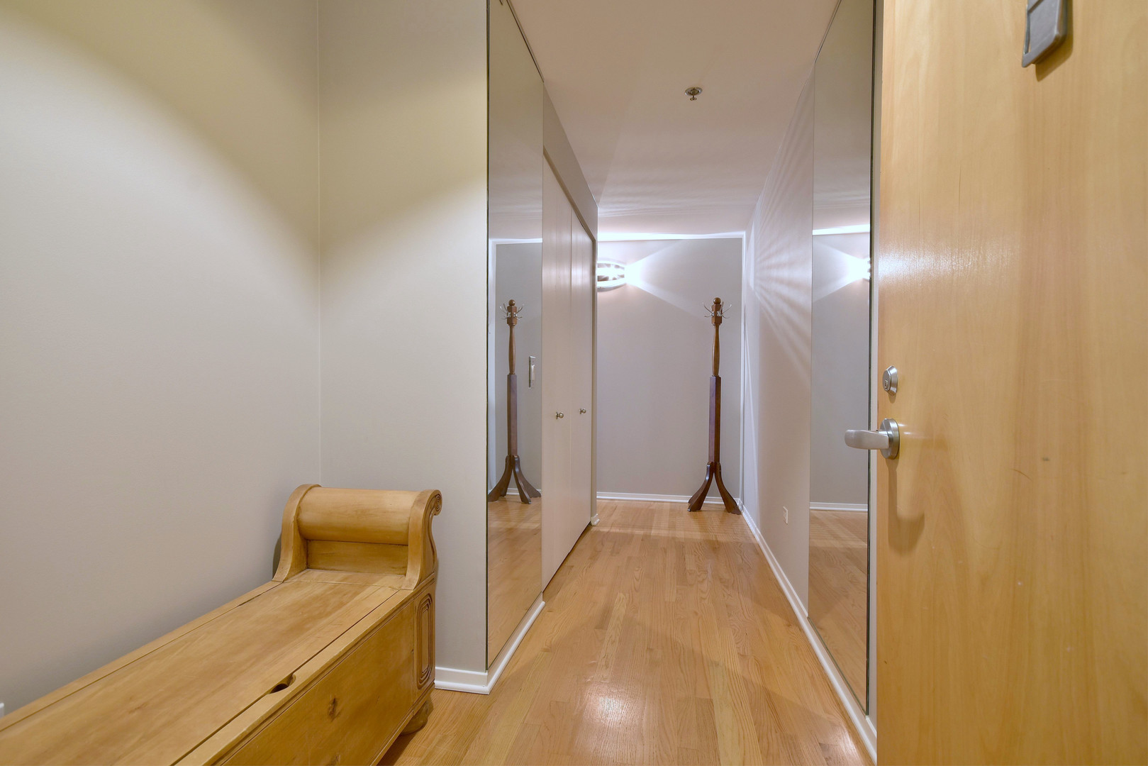 1201 West Adams Street, Unit 411 Chicago, IL 60607 - Photo 3 of 40 a view of a hallway with wooden floor and staircase
