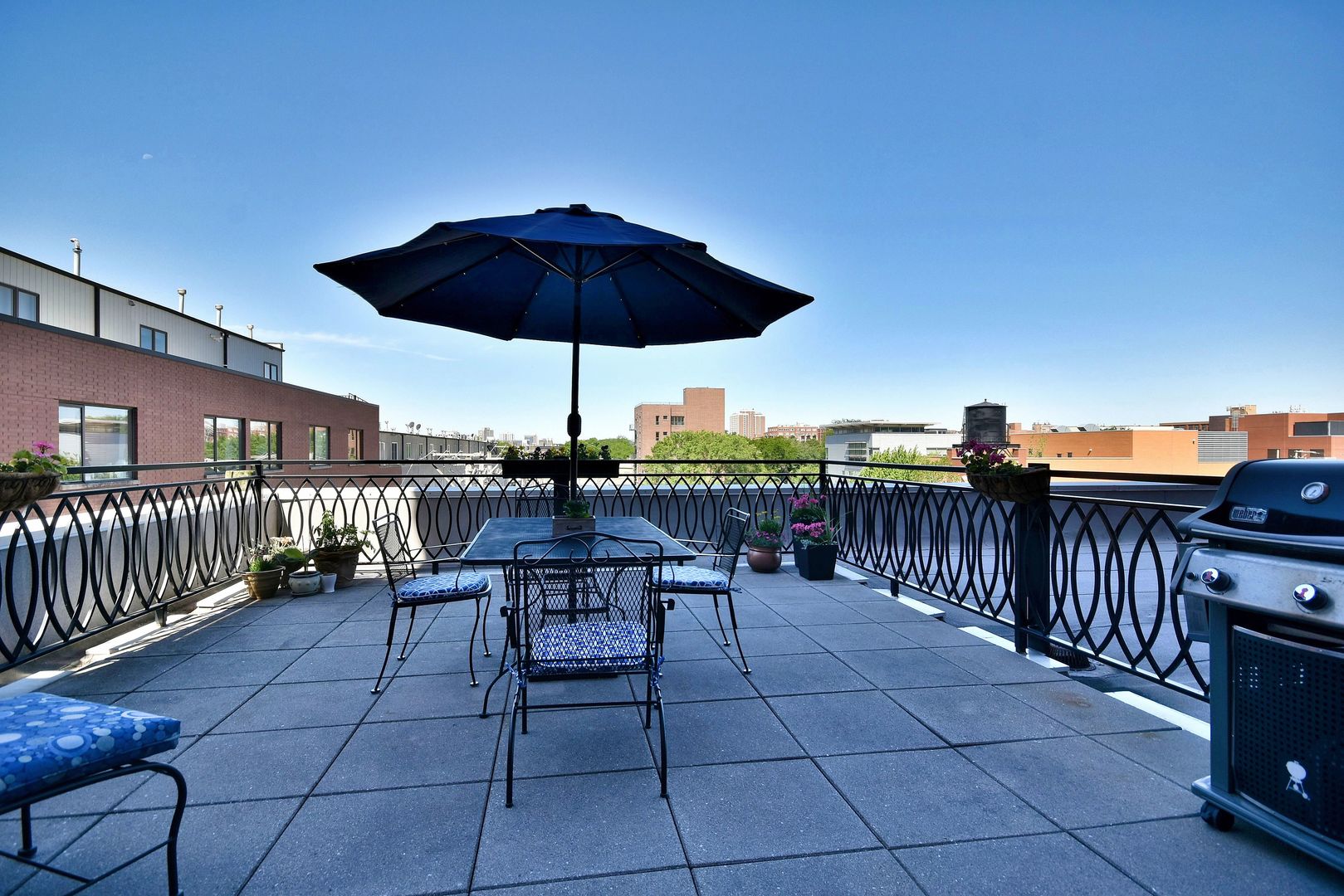 1201 West Adams Street, Unit 411 Chicago, IL 60607 - Photo 32 of 40 an outdoor space with furniture and umbrella