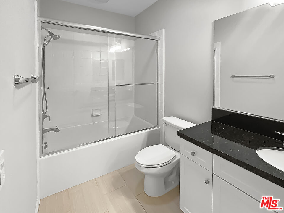 50 Evening Sun Irvine, CA 92620 - Photo 8 of 15 a bathroom with a granite countertop bathtub shower sink vanity and toilet