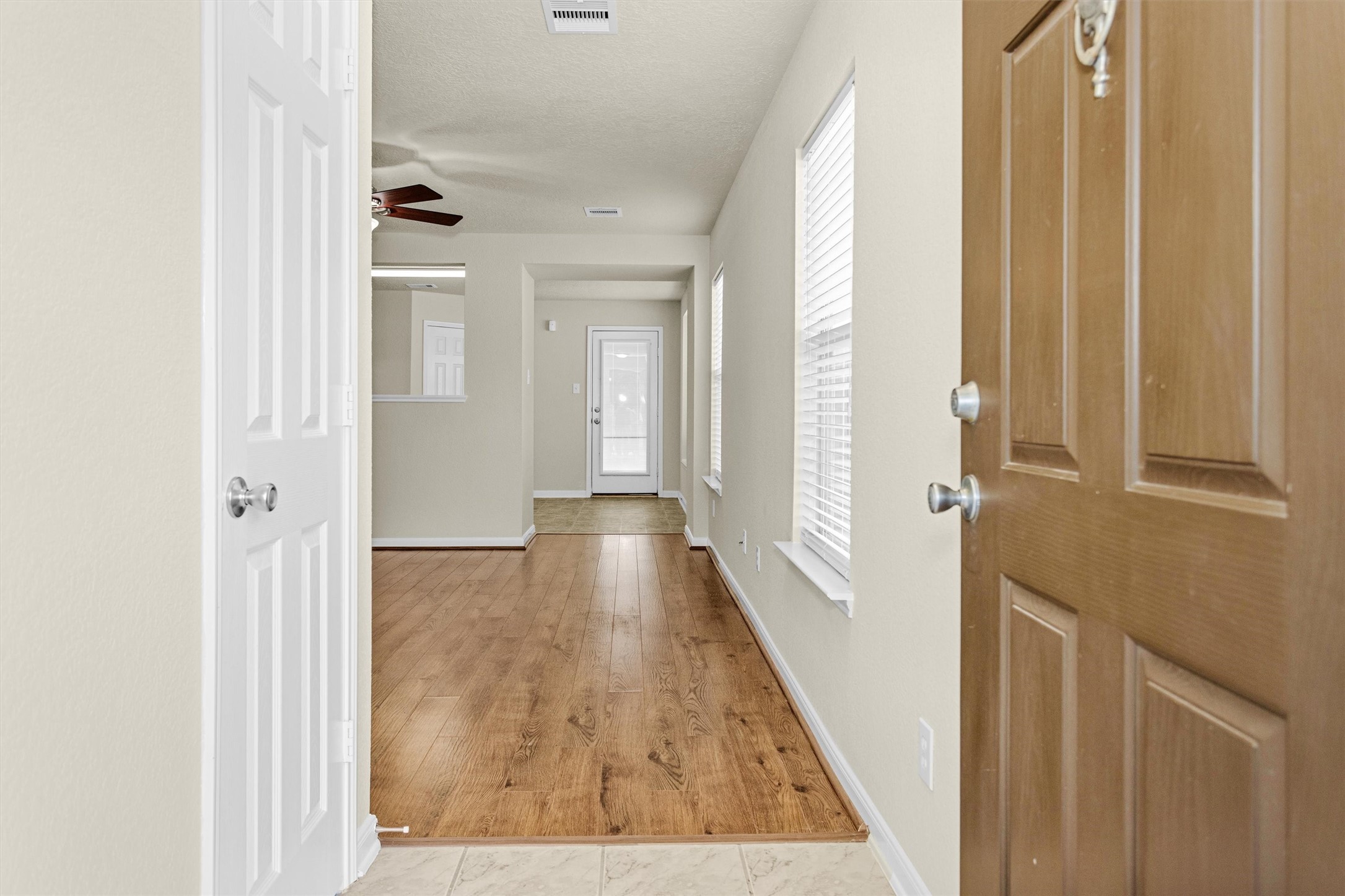 3131 Beacon Grove Street Spring, TX 77389 - Photo 6 of 38 a view of a hallway with wooden floor and staircase