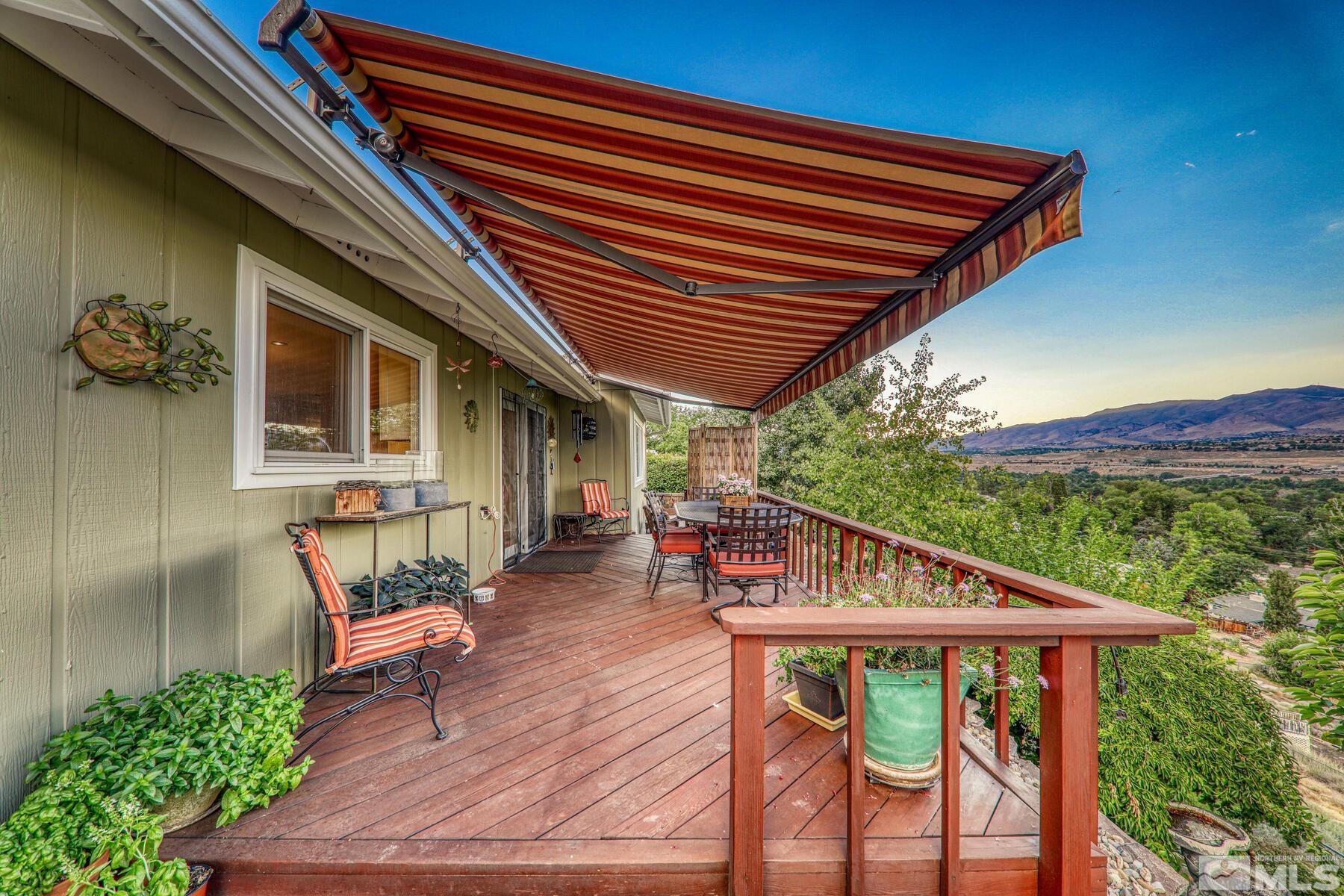2025 Heatheridge Lane Reno, NV 89509 - Photo 12 of 40 a view of house with outdoor seating and wooden floor
